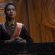 Gugu Mbatha-Raw presides as Judge Ravonna Renslayer wearing a red sash, in Marvel's new Disney+ series Loki.